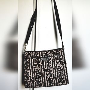 COACH canvas animal print crossbody bag.
